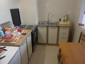Kuchyň nebo kuchyňský kout v ubytování Rooms Port