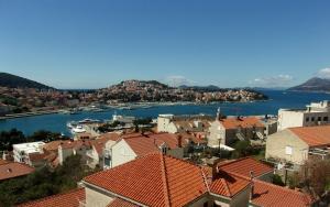 a view of a city with boats in the water at Rooms Port in Dubrovnik