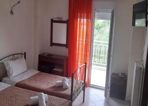 Postel nebo postele na pokoji v ubytování Hotel Kastri