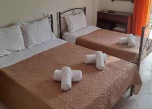 Postel nebo postele na pokoji v ubytování Hotel Kastri