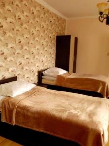 Katil atau katil-katil dalam bilik di Red Stone Guest House