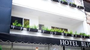 a hotel building with plants on the side of it at Hotel BLH 2 in Bucaramanga