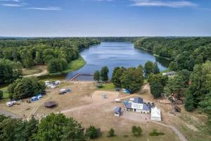 an aerial view of a camp site next to a river at Domek Letniskowy Napiórki in Przechlewo