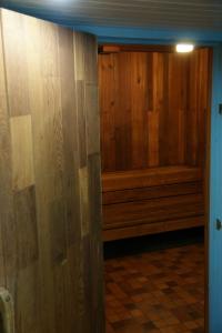 a room with a wooden wall with a bench at Canadas Best Value Inn & Suites-Vernon in Vernon