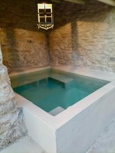 a large pool of water in a stone building at Casa Rural Sullà in Tremp