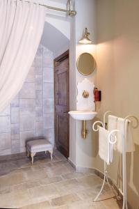 a bathroom with a shower with a curtain and a door at Casa Rural Sullà in Tremp