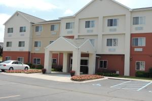 a large apartment building with a parking lot at Fairfield Inn Indianapolis South in Indianapolis