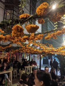 a group of people sitting in a room with flowers at Departamento luxury Condesa in Mexico City