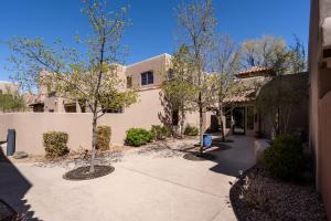 a walkway in front of a house with trees at El Corazon 12, Luxury 2 BRs, Sleeps 5 in Santa Fe