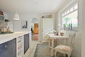 a kitchen with a table and a table and chairs at Private Apartment in Hannover