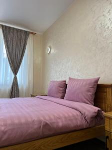 Postel nebo postele na pokoji v ubytování Eco Apartments Melnyka10