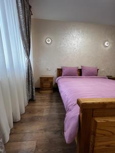Postel nebo postele na pokoji v ubytování Eco Apartments Melnyka10