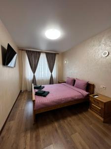Postel nebo postele na pokoji v ubytování Eco Apartments Melnyka10