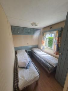 Postel nebo postele na pokoji v ubytování Camping Village Nature D'O