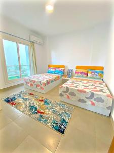 Ένα ή περισσότερα κρεβάτια σε δωμάτιο στο Chalet Amwaj North coast Q Zone +11 φωτογραφίες
