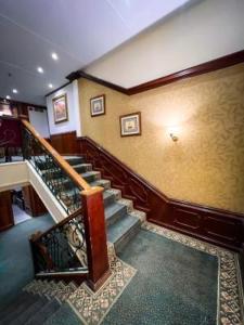 a spiral staircase in a building with a stair case at Prince Omar in Cairo