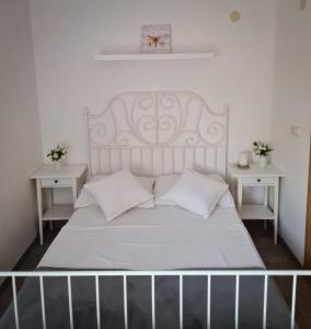 Postel nebo postele na pokoji v ubytování Villa Mena