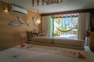 Postel nebo postele na pokoji v ubytování Pontal dos Carneiros Beach Bungalows + 37 fotografií