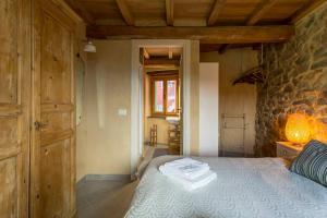 Postel nebo postele na pokoji v ubytování Casa Dafne