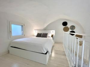 Кровать или кровати в номере CORTE DEI GOTHI - TREB Collection