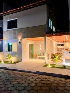 a living area of a house at night at Lencóis Ville Residence in Barreirinhas