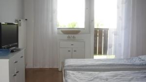 Posteľ alebo postele v izbe v ubytovaní Appartement am Strand