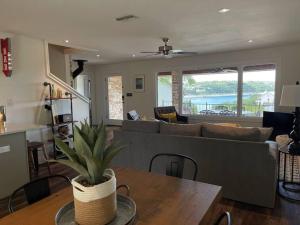 a living room with a couch and a table at Lakeview Bungalow-Access to Lake, Pool, Gym, &Park in Lago Vista