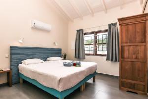Postel nebo postele na pokoji v ubytování ABC Resort Curacao + 37 fotografií