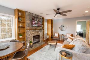 a living room with a couch and a fireplace at Whiskey Ridge in Boone