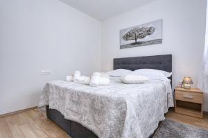 Postel nebo postele na pokoji v ubytování Apartments Poljak