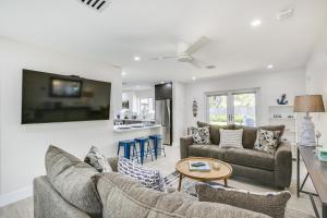 a living room with two couches and a table at Fort Lauderdale Vacation Rental about 8 Mi to Beaches! in Fort Lauderdale