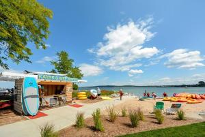 a beach with a life guard station and people on the beach at Fun & trendy condo close to downtown and the beach in Traverse City