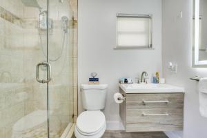 a bathroom with a shower and a toilet and a sink at Fort Lauderdale Vacation Rental about 8 Mi to Beaches! in Fort Lauderdale +23 photos