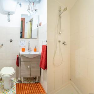 a bathroom with a shower and a toilet and a sink at Casarella Chiara in Naples