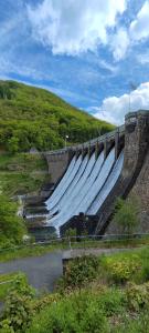 a large dam with a bunch of water at a river at diemelseeholiday romantisches Ferienhaus im Sauerland Nähe Willingen Winterberg in Diemelsee