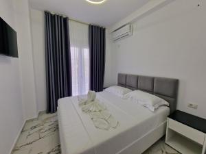 Postel nebo postele na pokoji v ubytování Vila Klari