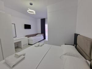 Postel nebo postele na pokoji v ubytování Vila Klari