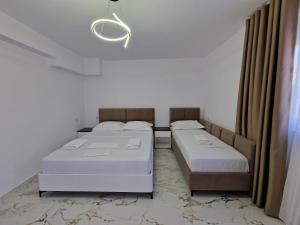 Postel nebo postele na pokoji v ubytování Vila Klari