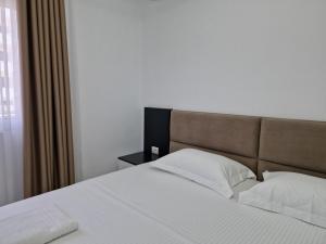 Postel nebo postele na pokoji v ubytování Vila Klari