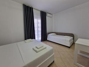 Postel nebo postele na pokoji v ubytování Vila Klari
