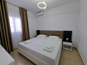 Postel nebo postele na pokoji v ubytování Vila Klari