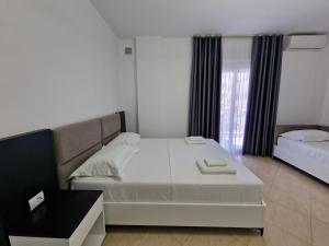 Postel nebo postele na pokoji v ubytování Vila Klari