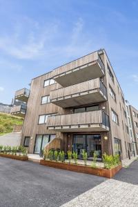 a large building with a lot of windows at JECI Apartment in Kjeller Lillestrøm - New, Modern and Central in Lillestrøm