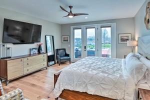 a bedroom with a bed and a flat screen tv at Beautiful Nashville Home near Downtown with Hot Tub! in Nashville