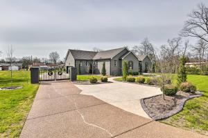 a house with a gate and a driveway at Beautiful Nashville Home near Downtown with Hot Tub! in Nashville