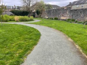 a winding path in front of a wall at James St Park 2 bed Gr Flr, sleeps 4 in Helensburgh