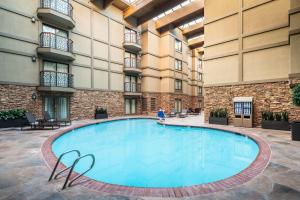 a large swimming pool in the courtyard of a hotel at Sheraton Park City in Park City