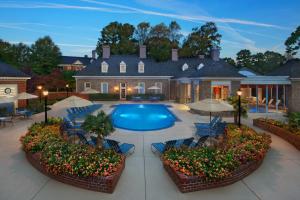 a large house with a swimming pool in front of it at Marriott's Manor Club at Ford's Colony in Williamsburg