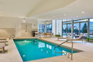 a pool in a house with a kitchen and a dining room at Element Basalt - Aspen in Basalt