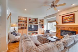 a living room with a couch and a fireplace at Dog-Friendly Denver Vacation Home with Gas Grill! in Denver